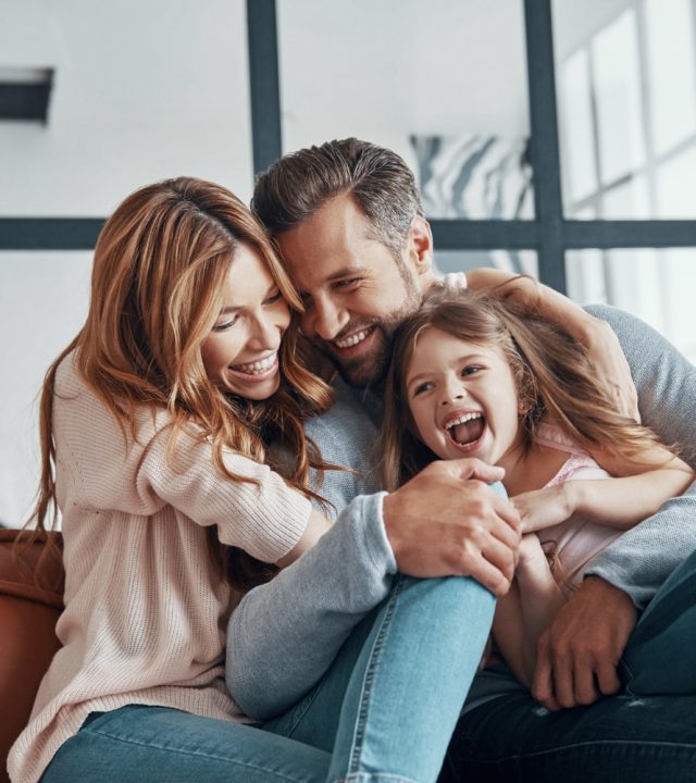 happy-young-family-bonding-together-home happy-young-family-bonding-together-home