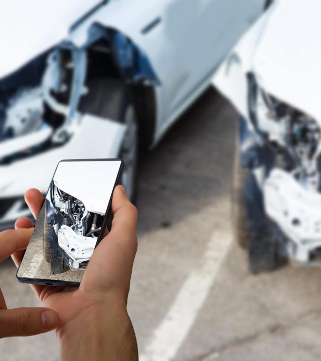 man-photographing-his-vehicle-with-damages-accident-insurance-with-smart-phone man-photographing-his-vehicle-with-damages-accident-insurance-with-smart-phone